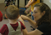 Students and parents participate in a game in the Kindermusik program at the Community Music Center. - Photo by Heather Phillips