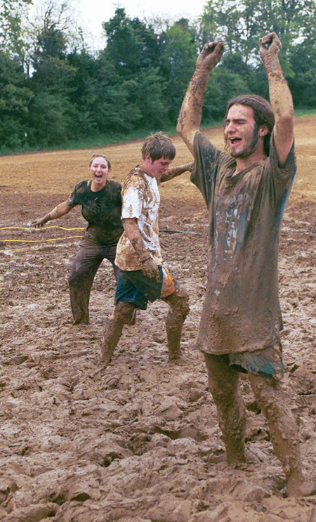 Freshman Seth Massa(front), Freshman Micah Moyers(center), and Sophomore Amy Yarbourgh celebrate after winning a game.