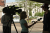 Freshman Kevin Furniss spoke with Channel 7 about the Global Night Commute march. - Photo by Heather Phillips