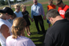 Brandon Boylan, women's soccer head coach, lead part of the team in prayer after practice Friday. This is a team tradition. - Photo by Heather Phillips