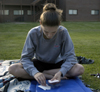 Junior Angela White spent some time studying for finals outside her dorm room in the McAfee complex. - Photo by Stephanny Rodriguez