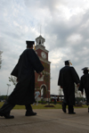 Graduates filed past Miller Tower on their way to the spring graduation ceremony. - Photo by Morris Abernathy