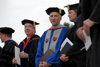 Commencement speaker Paul Corts (center), talks with Union Provost Carla Sanderson (right) and President David S. Dockery prior to the start of graduation ceremonies. Corts had been announced as the new president of the Council for Christian Colleges and Universities a few weeks prior to the event. - Photo by Morris Abernathy