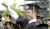 Kelly W. Reid of Cochrane, Alberta, Canada celebrates his completion of a bachelor of science in business administration. Reid studied international business. - Photo by Kyle Kurlick