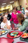 Donna Patterson, adjunct instructor of education, speaks with Lindsey Gaines and Lindsay Parrish during New Student Orientation. - Photo by Kristen Nicole Sayres