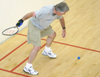 Jim Veneman, assistant professor of communication arts, serves during a game of raquetball. - Photo by Kyle Kurlick