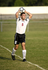 Sophmore defender Scott Sinclair throws the ball in to waiting teammates. - Photo by Kathleen Murray