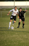Chris Prentice (18), Union defender, dribbles past the competition. - Photo by Kathleen Murray