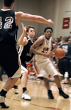 Junior forward Deywane Lee (white) drives to the basket in a game versus Freed-Hardeman University (Tenn.). - Photo by Kristen Nicole Sayres