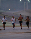 John Fox, Douglas Martin, Chris Arnold and Phillip Thompson of the men's cross country team practice early in the morning around Union's campus. - Photo by Brad Moore