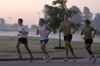 John Fox, Douglas Martin, Chris Arnold and Phillip Thompson of the men's cross country team practice early in the morning around Union's campus. - Photo by Brad Moore