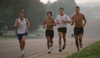 Douglas Martin, Phillip Thompson, John Fox, and Chris Arnold of the men's cross country team practice early in the morning in front of West Jackson Baptist Church, just outside of Union's campus. - Photo by Brad Moore