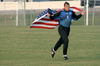 Senior goalie Robert Stinson carries the American Flag as he is introduced prior to a match at Union. - Photo by Kyle Kurlick