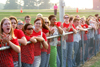 Bulldog fans line the fence at a men's soccer match. - Photo by Kyle Kurlick