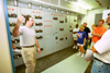 A group of students who took the environmental ethics class offered this summer at Union look at the inner workings of a local power plant. - Photo by Jim Veneman