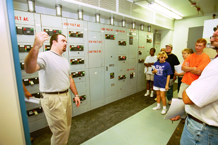 A group of students who took the environmental ethics class offered this summer at Union look at the inner workings of a local power plant.