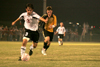 Freshman midfielder Cody Curtis (3), dribbles the ball downfield late in the game. - Photo by Kyle Kurlick