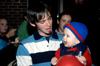Andy Robinette enjoys his time together with a younger family member at a dessert during Family Weekend. - Photo by Brad Moore