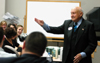 Chick-Fil-A founder Truett Cathy tosses out free Chick-Fil-A cows during his time with students in Harvey Hall. - Photo by Kristen Nicole Sayres