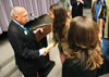 Sophomore Kristin Jennings greets Truett Cathy, founder of Chick-Fil-A, after he spoke in Harvey Hall. - Photo by Kristen Nicole Sayres