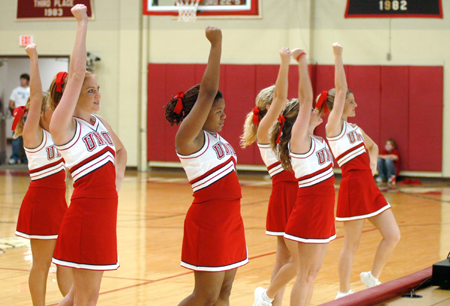 The Union University Bulldog cheerleaders motivate school spirit at a basketball game.