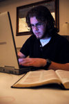 Cody King takes time to study among all the comotion during Mochafee in the McAfee commons.  - Photo by Kristen Nicole Sayres