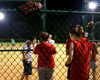 Jonathan Choi, Courtney Ford and Angela White wait for their time at bat during an intramural softball game. - Photo by Stephanny Rodriguez
