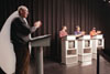 Assignment: <i>Head to Head</i> - Assistant Professor of Communication Arts and host of <i>Head to Head</i>, Steve Beverly applauds a winning contestant. - Photo by Kristen Hiller