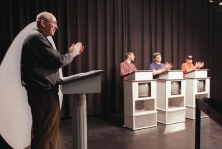 Assignment: <i>Head to Head</i> - Assistant Professor of Communication Arts and host of <i>Head to Head</i>, Steve Beverly applauds a winning contestant.