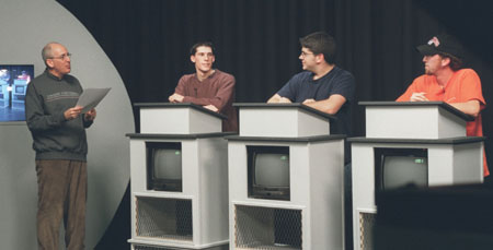 Assignment: <i>Head to Head</i> - Steve Beverly, assistant professor of communication arts, greets trial contestants.