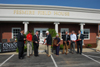Benny Fesmire prepares to cut the ribbon at the Fesmire Field House. - Photo by Morris Abernathy