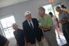 The Fesmires are congratulated by William Giles shortly after the dedication of the Fesmire Field House. - Photo by Morris Abernathy