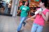 Alanna Taylor and Mary Zang run through the Mall to get a cup from the food court so they can complete their scavenger hunt in Jackson during New Student Orientation. - Photo by Kyle Kurlick
