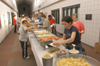 Lunch was served by ARAMARK Sunday afternoon in the hallway of the Barefoot Student Union Building for the students and those helping with the tornado clean-up. - Photo by Jim Veneman