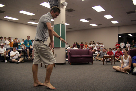 Ross Barnes pops and locks for the audience at the New Student Orientation open mic night.