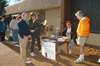 Early Monday morning, faculty and staff began to arrive to volunteer for tornado damage clean-up.  Here President David S. Dockery and Provost Carla Sanderson begin to organize the volunteers into teams.  Also pictured: Marketing professor Darin White and Theatre professor David Burke - Photo by Jim Veneman