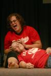 In the skit &ldquo;Doctor, Doctor&rdquo; Cassie Harris cries over Jill Casey whom has just been hit by a speedy driver during the Focus Show. - Photo by Stephanie Schroeder