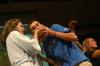 Andrew Courtner eats the peanut butter off of Lindsey Abell's hands at the end of the peanut butter demonstration during the Focus Show. - Photo by Stephanie Schroeder