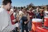 Union First Lady Lanese Dockery assists by bringing water around to the clean-up volunteers. - Photo by Jim Veneman