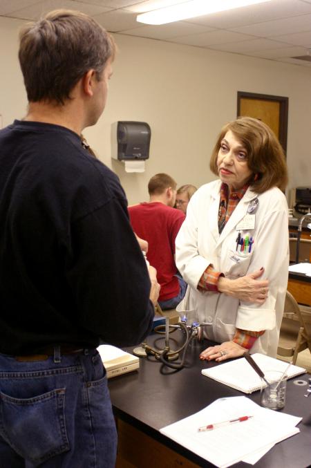 Elsie Smith, associate professor of biology, talks to freshman Sammy Pace, who is taking prerequisite classes for pharmaceutical school. Smith has been teaching students for 44 years.