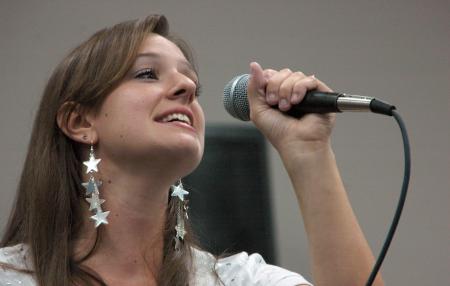 Freshman Kaileen Butler performs &ldquo;His eye is on the sparrow&rdquo; at open mic night during New Student Orientation.