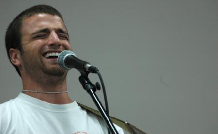 Life group leader Chris Rigney performs &ldquo;the death of white lightning&rdquo; at open mic during New Student Orientation. 