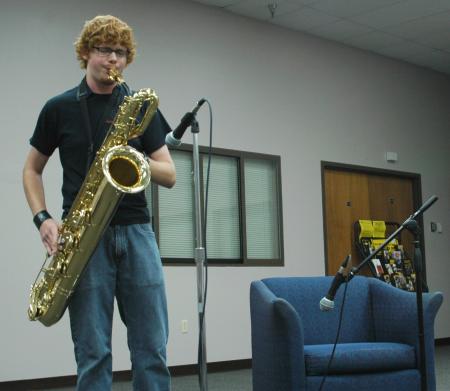 Freshman Cory Taylor plays the saxophone at open mic night during New Student Orientation. 