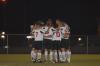Just before their game against Lindsey Wilson College, the men's soccer team huddles up. - Photo by Morris Abernathy