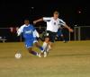 Senior Mark Forrest gets tangled up with a Lindsey Wilson opponent. - Photo by Morris Abernathy