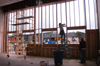 Repairs began Monday to the Hurt Commons that lost an entire wall of glass to the tornado. - Photo by Jim Veneman