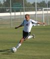 Colin Bonner, junior midfielder, kicks the ball downfield to waiting teammates. - Photo by Steven Aldridge