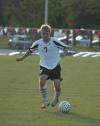 Senior forward Craig Clark dribbles the ball downfield. - Photo by Steven Aldridge