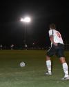 Sophomore Wagner Oliveira prepares to kick to ball back into play against Lindsey Wilson. - Photo by Stephanie Schroeder