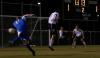 Senior Duncan Nicol braces himself as a Lindsey Wilson opponent makes a shot on goal as Junior Colin Bonner looks on. - Photo by Stephanie Schroeder